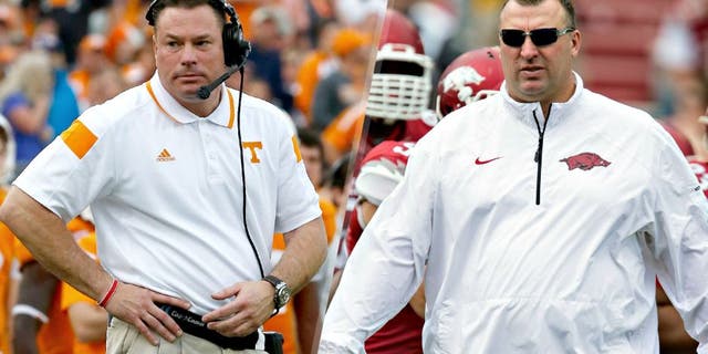 JACKSONVILLE, FL - JANUARY 02: Head coach Butch Jones of the Tennessee Volunteers watches the action during the TaxSlayer Bowl against the Iowa Hawkeyes at EverBank Field on January 2, 2015 in Jacksonville, Florida. (Photo by Sam Greenwood/Getty Images) FAYETTEVILLE, ARKANSAS - APRIL 26: Head Coach Bret Bielema of the Arkansas Razorbacks watches his team warm up before the Red White Spring Football game at Razorback Stadium on April 26, 2014 in Fayetteville, Arkansas. (Photo by Wesley Hitt/Getty Images)
