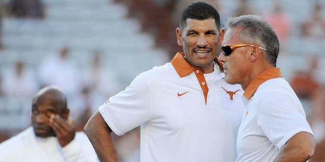 Sep 12, 2015; Austin, TX, USA; Texas Longhorns wide receivers coach Jay Norvell (left) talks with quarterbacks coach Shawn Watson (right) prior to kick off against the Rice Owls at Darrell K Royal-Texas Memorial Stadium. Texas beat Rice 42-28. Mandatory Credit: Brendan Maloney-USA TODAY Sports