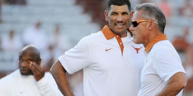 Sep 12, 2015; Austin, TX, USA; Texas Longhorns wide receivers coach Jay Norvell (left) talks with quarterbacks coach Shawn Watson (right) prior to kick off against the Rice Owls at Darrell K Royal-Texas Memorial Stadium. Texas beat Rice 42-28. Mandatory Credit: Brendan Maloney-USA TODAY Sports