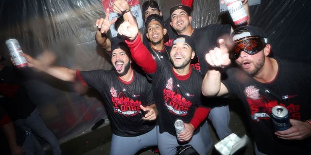 Sep 30, 2015; Pittsburgh, PA, USA; St. Louis Cardinals players pose for a photo after defeating the Pittsburgh Pirates to clinch the National League Central Division Championship at PNC Park. The Cardinals won 11-1. Mandatory Credit: Charles LeClaire-USA TODAY Sports
