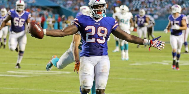 The Miami Dolphins defense fails to stop Buffalo Bills' Karlos Williams as he scores a touchdown during the fourth quarter on Sunday, Sept. 27, 2015, at Sun Life Stadium in Miami Gardens, Fla. (Charles Trainor Jr./Miami Herald/TNS via Getty Images)