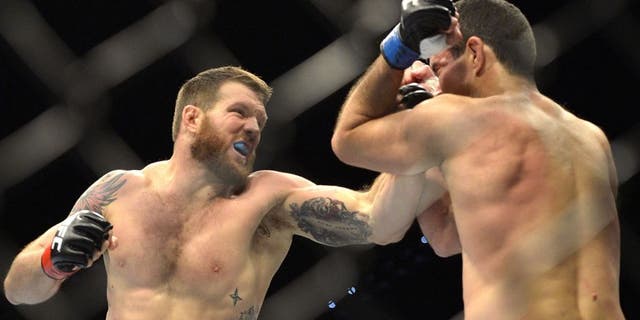 BRISBANE, AUSTRALIA - DECEMBER 07: Ryan Bader of the USA punches Anthony Perosh of Australia during their UFC Fight Night Brisbane bout at the Brisbane Entertainment Centre on December 7, 2013 in Brisbane, Australia. (Photo by Bradley Kanaris/Getty Images)