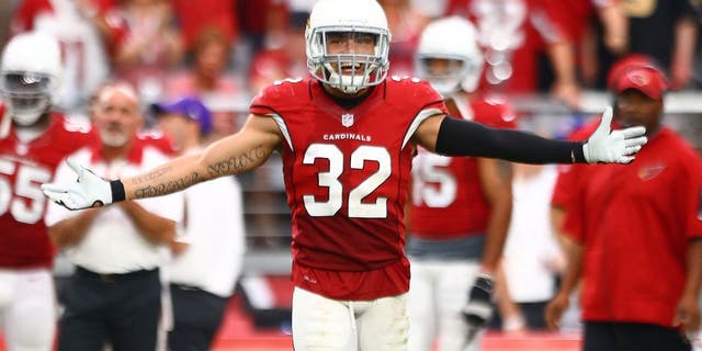 Sep 13, 2015; Glendale, AZ, USA; Arizona Cardinals safety Tyrann Mathieu (32) celebrates a play in the fourth quarter against the New Orleans Saints at University of Phoenix Stadium. The Cardinals defeated the Saints 31-19. Mandatory Credit: Mark J. Rebilas-USA TODAY Sports