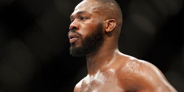 LAS VEGAS, NV - JANUARY 03: Light heavyweight champion Jon Jones waits in a timeout as he defends his title against Daniel Cormier during the UFC 182 event at the MGM Grand Garden Arena on January 3, 2015 in Las Vegas, Nevada. Jones retained his title by unanimous decision. (Photo by Steve Marcus/Getty Images)