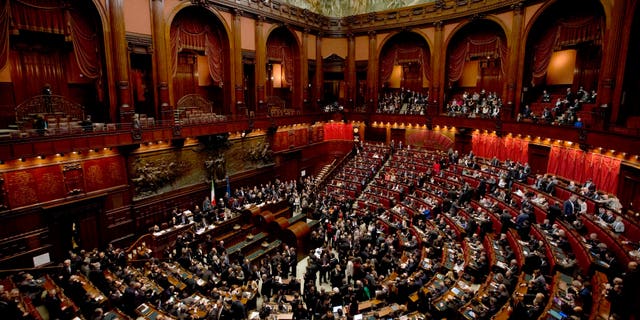 Italian lawmakers gather to vote on a new president whose first job will be to seek the formation of a new government after inconclusive elections, in Rome Thursday, April 18, 2013. Political parties sparred over suitable candidates for the post being vacated by Giorgio Napolitano ahead of the Thursday vote, reflecting divisions that they have been unable to overcome in the more than 50 days since the Feb. 24-25 elections. Napolitano's term expires next month. (AP Photo/Alessandra Tarantino)