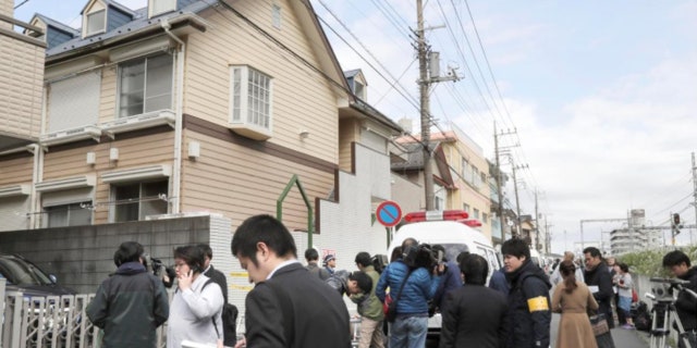 Members of the media gather in front of an apartment building where nine bodies were reportedly found in Zama, Kanagawa Prefecture, Japan.