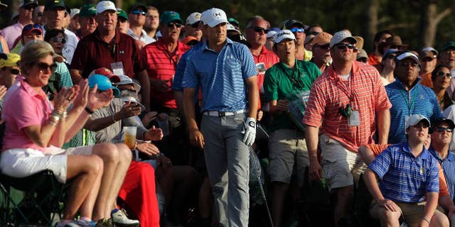 Jordan Spieth watches his hit out of the gallery on the 18th hole during the third round of the Masters golf tournament Saturday, April 11, 2015, in Augusta, Ga. (AP Photo/Chris Carlson)
