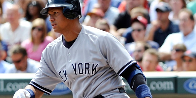 Aug 21: Alex Rodríguez bats against the Twins. (AP/Jim Mone)