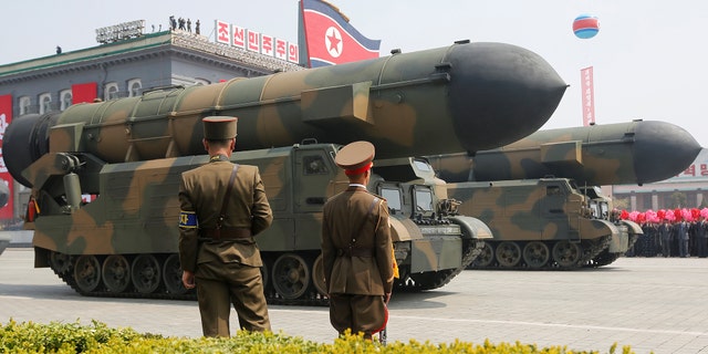 Missiles are driven past the stand with North Korean leader Kim Jong Un and other high ranking officials during a military parade marking the 105th birth anniversary of North Korea's founding father, Kim Il Sung, in Pyongyang, April 15, 2017. REUTERS/Sue-Lin Wong - RTS12FMN
