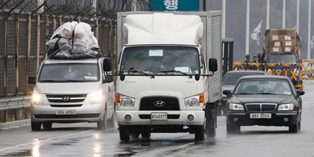 April 6, 2013: South Korean vehicles arrive back from the North Korean city of Kaesong at Unification Bridge in Paju, South Korea.