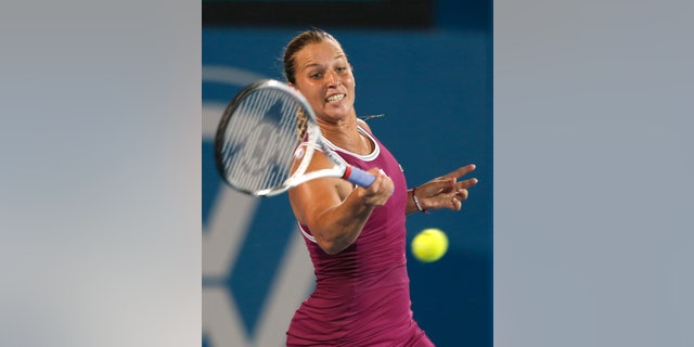Slovakia's Dominika Cibulkova returns a shot to Poland's Agnieszka Radwanska during the women's final of the Sydney International tennis tournament in Sydney, Australia, Friday, Jan. 11, 2013. Radwanska won the match 6-0, 6-0. (AP Photo/Rob Griffith)