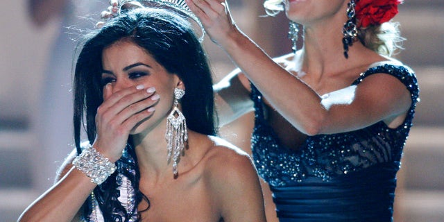 May 16: Miss Michigan Rima Fakih is crowned Miss USA 2010 by Kristen Dalton, Miss USA 2009.