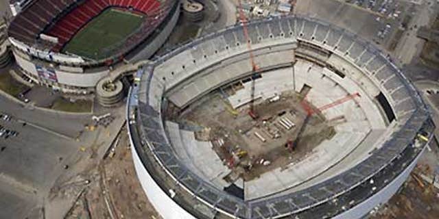 March 22: The under-construction Giants Stadium, right, and the older and still in use Giants Stadium, left.