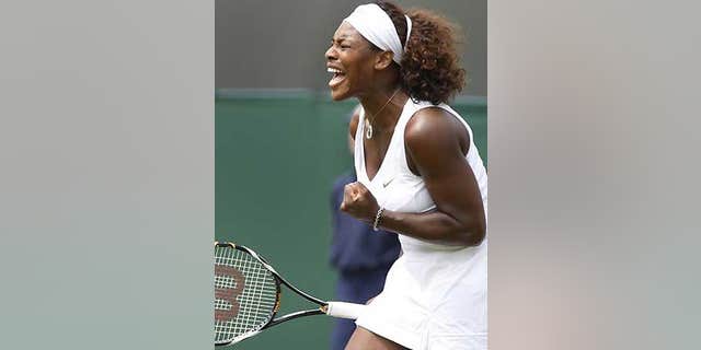 June 26: Serena Williams celebrates winning a point against Roberta Vinci of Italy during their third round singles match at Wimbledon, Friday.