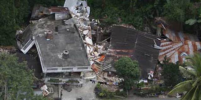 Oct. 3: Damaged houses are seen in this aerial image of an area affected by earthquake-triggered landslide in Padang Pariaman, West Sumatra.