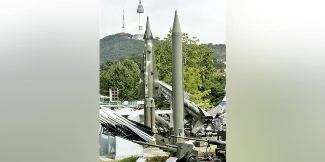 Oct. 8: A model of mock North Korea's Scud-B missile, center right in plain green, and other S. Korean missiles are displayed in Seoul, South Korea.