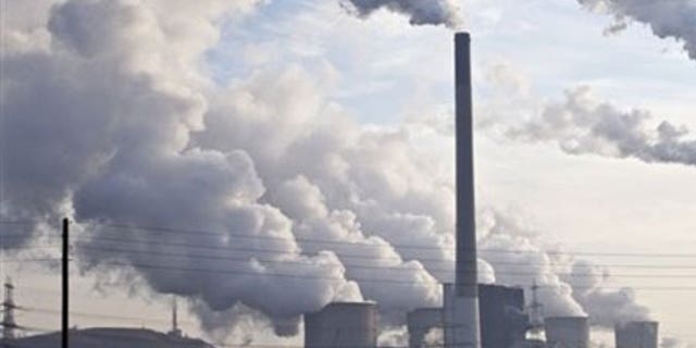 Dec. 16: Steam and smoke is seen over the coal burning power plant in Gelsenkirchen, Germany. Coal power plants are among the biggest producer of CO2.