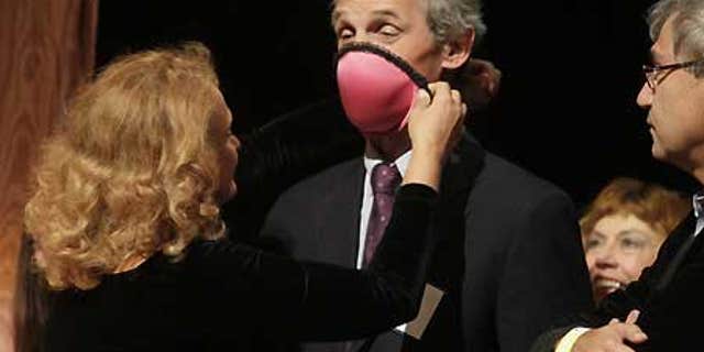 Dr. Elena Bodnar, left, took home the 2009 Ig Nobel Public Health Prize for designing a bra that can be converted into two gas masks.