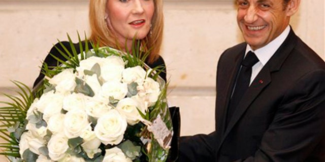 Feb. 3: British writer J.K. Rowling, left, receives a bouquet from French President Nicolas Sarkozy during a ceremony at the Elysee Palace in Paris.