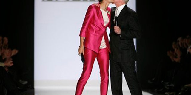 Heidi Klum and Tim Gunn kiss after the Project Runway Season 6 Finale show during Fashion Week Friday, Feb. 20, 2009 in New York. (AP Photo/Jason DeCrow)