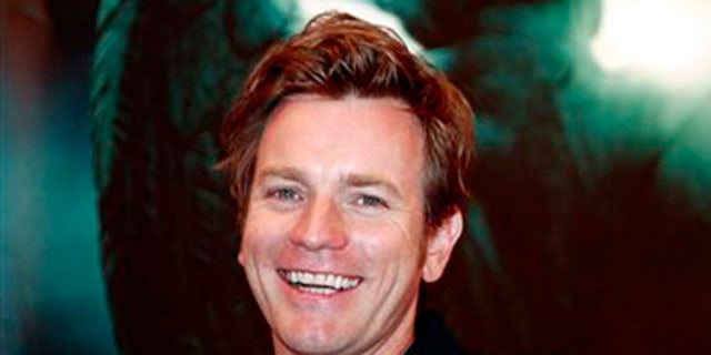 British actor Ewan McGregor smiles during a press conference of U.S. movie Angels and Demons as part of the 12th Shanghai International Film Festival Sunday June 21, 2009 in Shanghai, China. Actor Ewan McGregor says the Vatican's criticism of the religious thriller "Angels and Demons" was muted compared to the previous Robert Langdon adventure "The Da Vinci Code" because the newer film doesn't challenge the Catholic faith. (AP Photo/Eugene Hoshiko)