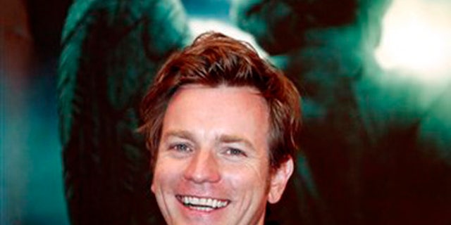 British actor Ewan McGregor smiles during a press conference of U.S. movie Angels and Demons as part of the 12th Shanghai International Film Festival Sunday June 21, 2009 in Shanghai, China. Actor Ewan McGregor says the Vatican's criticism of the religious thriller "Angels and Demons" was muted compared to the previous Robert Langdon adventure "The Da Vinci Code" because the newer film doesn't challenge the Catholic faith. (AP Photo/Eugene Hoshiko)