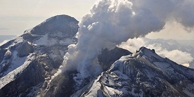 In this May 8, 2009 photo provided by the Alaska Volcano Observatory, the summit crater, active lava dome, and steam plume of the Mount Redoubt volcano, located about 100 miles southwest of Anchorage, are shown. Mount Redoubt hasn't had a major eruptive event in more than a month but scientists say that could soon change. (AP Photo/Alaska Volcano Observatory, USGS, Chris Waythomas)