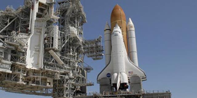 The space shuttle Endeavour sits atop Pad 39A at NASA's seaside Kennedy Space Center launch complex.
