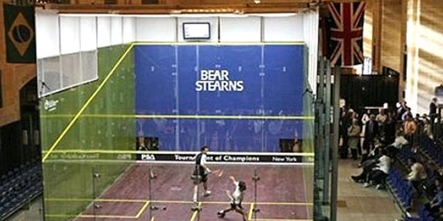 Jan. 10, 2008: Anwar Reda, left, of Egypt, watches as countryman Mohammed Abbas goes for a shot in the Tournament of Champions in New York.