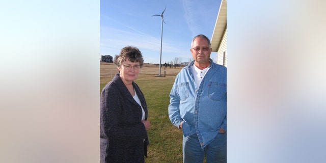 Jeanne and Larry Walth, of Wishek, N.D., save roughly $50 monthly using the wind turbine city officials say must come down.