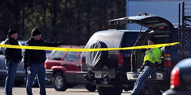 Jan. 12: Police gather after a shooting at Penske Rental in Kennesaw, Ga.