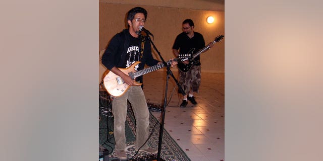 Saudi rock musician and journalist Hasan Hatrash, left, must contend with the unwelcome attention of Saudi Arabia's religious police, which frowns on Western-style music and dress.