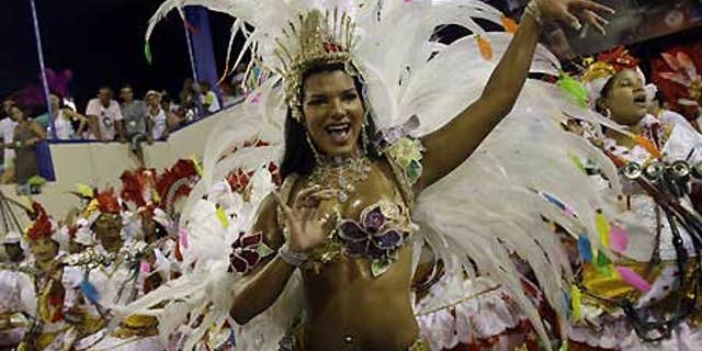 Feb. 24: Juliane Almeida, queen of the drums' section of Viradouro samba school dances during carnival parade at the sambodrome, in Rio de Janeiro.