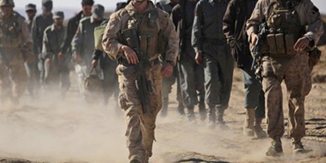 Dec. 5: U.S. Marines escort new Afghan National Police officers to their base in Khan Neshin in the province of Helmand, southern Afghanistan.