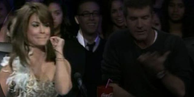 Paula Abdul gives some advice to an overly chatty contestant as the finals get underway.