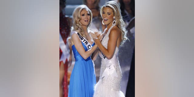 Former Miss California Carrie Prejean, right, congratulates winner, Miss North Carolina Kristen Dalton at the Miss USA pageant.