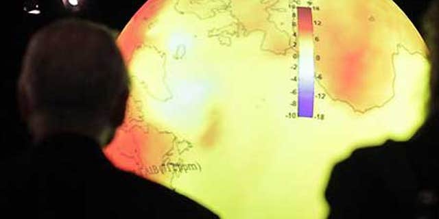 Dec. 8: Delegates look at a giant balloon displaying the warming of the world's oceans at the U.S. center at the U.N. Climate Summit in Copenhagen.