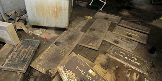 July 10: Grave markers scattered on the floor of a shack at the Burr Oak Cemetery in Alsip, Ill.
