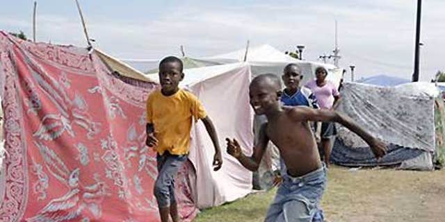Jan. 26: Boys play in a tent city called Mais Gate near Port au Prince airport.