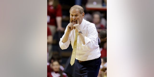 Michigan head coach John Beilein signals to his team as they play Indiana in the second half of an NCAA college basketball game in Bloomington, Ind., Sunday, Feb. 2, 2014. Indiana defeated Michigan 63-52. (AP Photo/Michael Conroy)