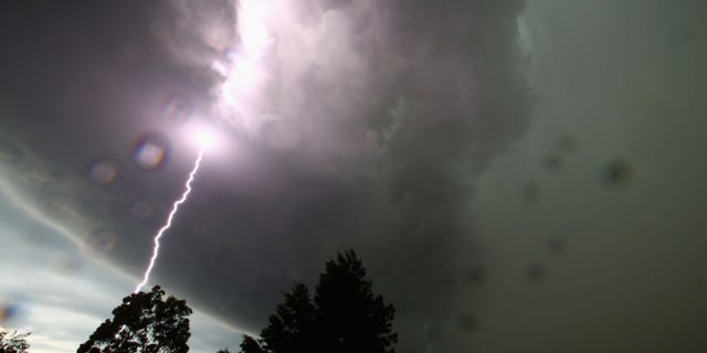 SYDNEY, AUSTRALIA - OCTOBER 13: A general view is seen of a lightning strike as a severe storm hits Sydney on October 13, 2014 in Sydney, Australia. (Photo by Mark Kolbe/Getty Images)