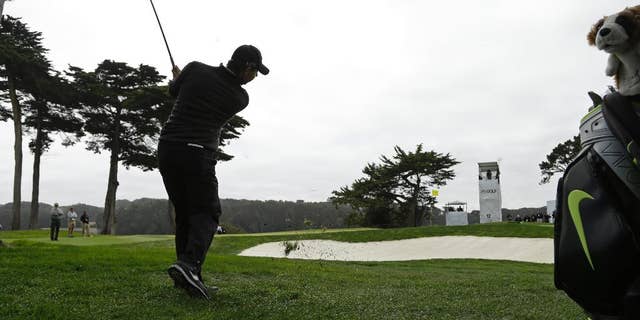 Rory McIlroy, of Northern Ireland, hits out of the rough to the 12th green during the Match Play Championship golf tournament at TCP Harding Park on Sunday, May 3, 2015, in San Francisco. McIlroy won the tournament. (AP Photo/Ben Margot)