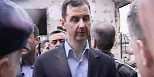 March 27, 2012: In this image made from video, Syrian President Bashar Assad visits Baba Amr neighborhood in Homs, Syria.