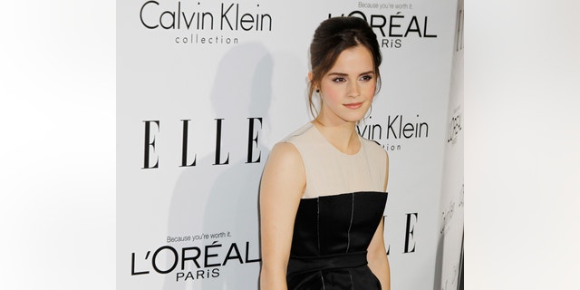 Honoree Emma Watson poses as she arrives at the 19th Annual ELLE Women in Hollywood dinner in Beverly Hills, California October 15, 2012. The event honors women who have had a profound impact on the film industry.