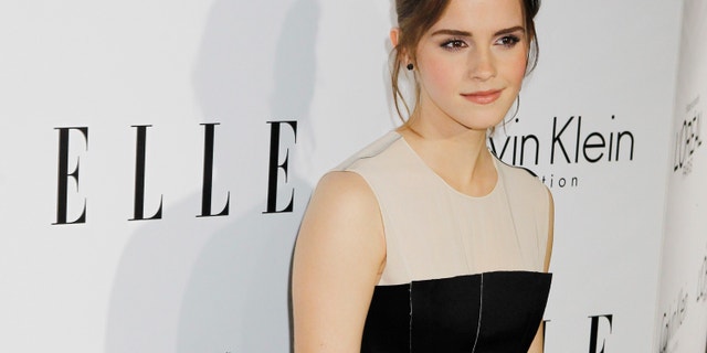 Honoree Emma Watson poses as she arrives at the 19th Annual ELLE Women in Hollywood dinner in Beverly Hills, California October 15, 2012. The event honors women who have had a profound impact on the film industry.