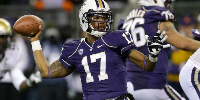 Washington quarterback Keith Price (17) passes against Colorado in the first half of an NCAA college football game on Saturday, Nov. 9, 2013, in Seattle. (AP Photo/Ted S. Warren)