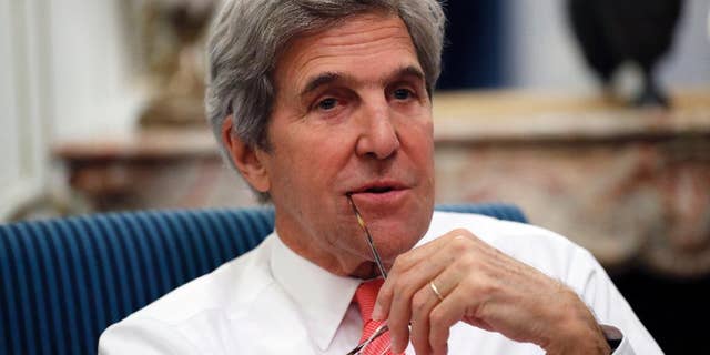 U.S Secretary of State John Kerry speaks with the media after attending the Mideast peace conference Sunday, Jan. 15, 2017 in Paris, France. Kerry, who has been increasingly outspoken about Mideast tensions, was in Paris defending American interests at the conference in his last major diplomatic foray before he leaves office. (AP Photo/Alex Brandon, Pool)
