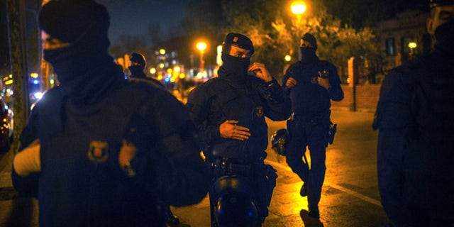 BARCELONA, SPAIN - MARCH 11: Catalan Autonomous riot police officers stand guard at the first Pegida rally on March 11, 2015 in Barcelona, Spain. Pegida Catalonia has called for the first Pegida Spain march in on the 11th anniversary of the 2004 Madrid train bombings. (Photo by David Ramos/Getty Images)