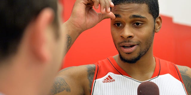 Louisville's Chane Behanan fields questions during NCAA college basketball media day, Saturday, Oct. 12, 2013, in Louisville, Ky. (AP Photo/Timothy D. Easley)
