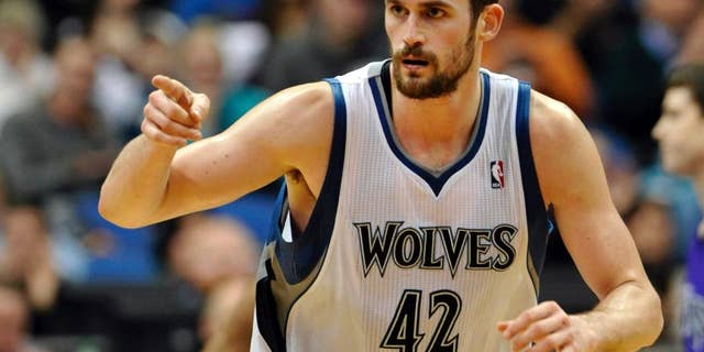 FILE - In this Jan. 16, 2012, file photo, Minnesota Timberwolves' Kevin Love reacts during the second half of an NBA basketball game against the Sacramento Kings in Minneapolis. The Timberwolves, Cleveland Cavaliers and Philadelphia 76ers completed a blockbuster trade sending Love to team up with LeBron James in Cleveland for 2014 No. 1 draft pick Andrew Wiggins on Saturday, Aug. 23, 2014, a person familiar with the trade said. The Timberwolves are getting Wiggins and former top pick Anthony Bennett from Cleveland and veteran forward Thaddeus Young from Philadelphia. The 76ers get a 2015 first-round draft choice from Cleveland, and guard Alexey Shved and forward Luc Mbah a Moute from Minnesota. (AP Photo/ Jim Mone, File)